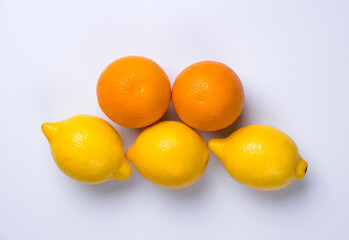 Close up of citrus fruits orange and lemon isolated on white background.