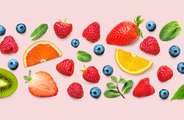 Fruit and berry pattern of various ripe berries and leaves on pink background. Fruit border frame banner. Flat lay.