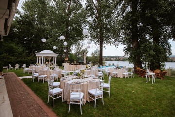 Beautiful pastel floral decoration for outdoor celebration by the river