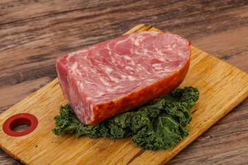 Beef ham piece over board