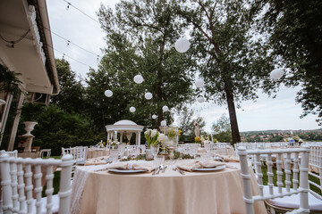Beautiful pastel floral decoration for outdoor celebration by the river