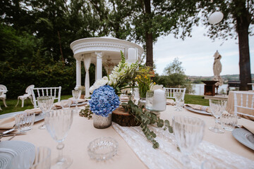Beautiful pastel floral decoration for outdoor celebration by the river
