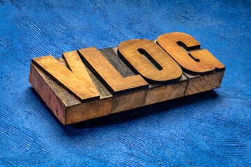 vlog (video blog) word in vintage letterpress wood type, social media, web television and internet communication concept