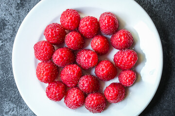 raspberry raw ripe red juicy berries Menu concept serving . food background top view copy space organic healthy eating