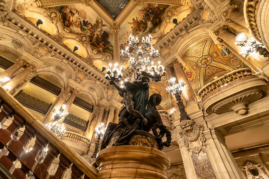 Paris, France - March 17, 2018: View of chandeliers inside of the Palais Garnier (Opera Garnier) in Paris, France. It was originally called the Salle des Capucines.