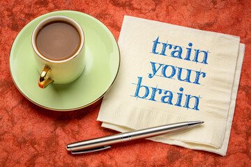 train your brain motivational note - handwriting on a napkin with coffee, mental health and personal development concept