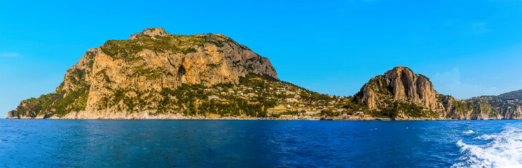 Obraz premium A panorama view of the southern side of the island of Capri, Italy viewed from the sea