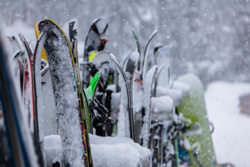 Skis on the rack in a snow storm 