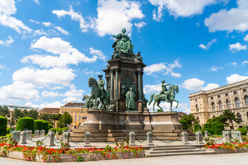 Fototapeta na wymiar Vienna, Austria - june 24th 2020 - Maria Theresian Platz (square) with several statues inbetween museums during Corona time on a sunny day