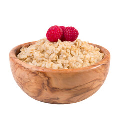 Oatmeal with raspberry berries in a wooden bowl isolated on a white background.