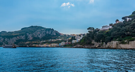 Fototapeta na wymiar Marina grande nestled between two hills on the northern of the island of Capri, Italy