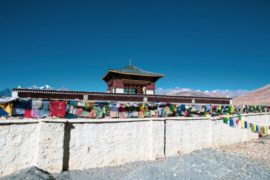 Muktinath temple prayer flags at Mustang, Nepal. Sunny day and blue sky.