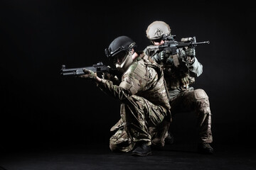 American special forces, two soldiers in military uniform with weapons attack, elite troops on special missions, counter-terrorist