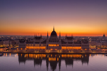 Fototapeta na wymiar Aerial drone shot of Hungarian Parliament lights off before sunrise in Budapest dawn