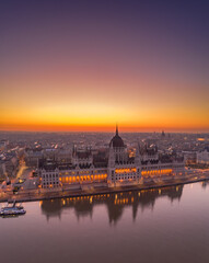 Fototapeta premium Aerial drone shot of Hungarian Parliament lights off before sunrise in Budapest dawn