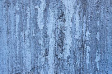 old ragged wall with white spots and scratches of paint. rough surface texture