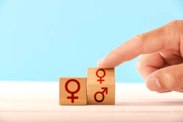 lgbt concept. man flips a wooden block and changes icons