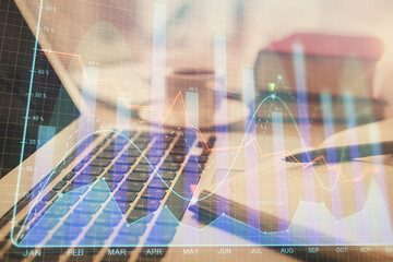 Double exposure of financial chart drawing and desktop with coffee and items on table background. Concept of forex market trading