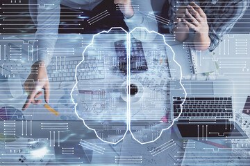 Double exposure of man and woman working together and human brain hologram drawing. Brainstorm concept. Computer background. Top View.