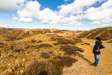 Small boy admiring the landscape of stony mountain, Parys Mountain