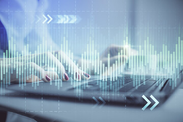 Multi exposure of woman hands typing on computer and financial graph hologram drawing. Stock market analysis concept.