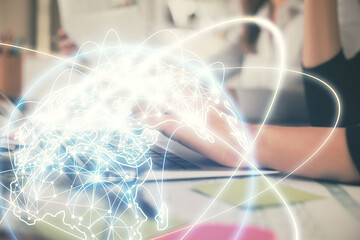 Multi exposure of woman hands typing on computer and business theme hologram drawing. Success concept.