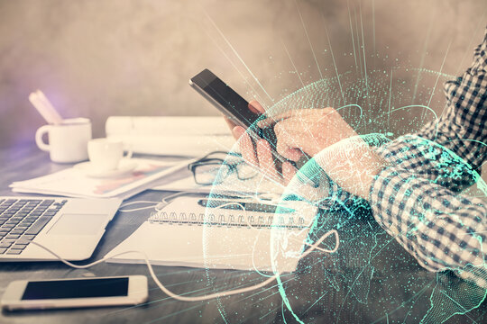 Double exposure of man's hands holding and using a phone and social network theme drawing.