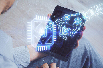 Double exposure of man's hand holding and using a digital device and data theme drawing. Technology concept.