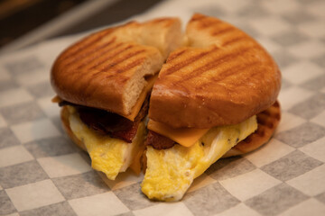 Fresh Bagel Bacon Egg Cheese Breakfast Sandwich on Checkerboard Wrap