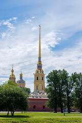 Russia, St. Petersburg, July 3, 2020, Peter and Paul Fortress .. The photo shows the Peter and Paul Fortress close-up among the trees, view from the arrow of Vasilyevsky Island