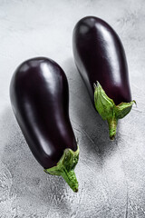 Raw purple eggplant. Organic vegetables. Gray background. Top view