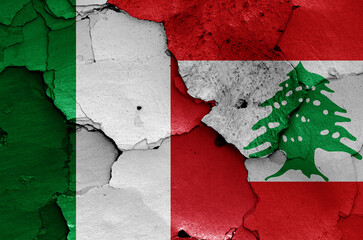 flags of Italy and Lebanon painted on cracked wall