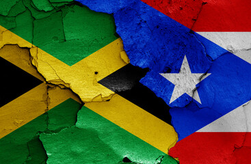 flags of Jamaica and Puerto Rico painted on cracked wall