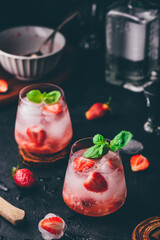 Cocktail with strawberry, gin and tonic