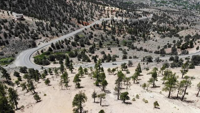  Fly toward mountain road with traffic Geiger grade Reno NV.