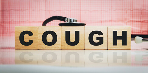 Cough word on wooden cubes. Conceptually for healthcare, hospital, clinic and medical business.