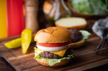 burger on wooden cutting board