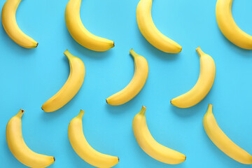 Ripe bananas on color background