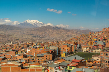 The City of El Alto / La Paz, Bolivia Seen From the Sky With High Mountains Peaks of the Andes Cordillera