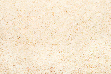 Heap of raw rice as background