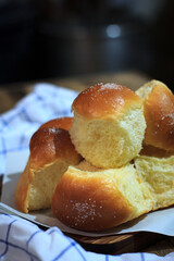 Delicious baked bread on the wooden table