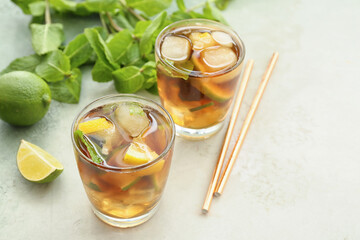 Glasses of tasty Cuba Libre cocktail on table