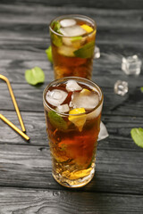 Glasses of tasty Cuba Libre cocktail on table