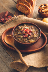 Bowl of tasty lentils soup on table
