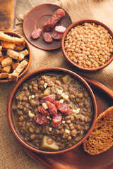 Bowl of tasty lentils soup on table