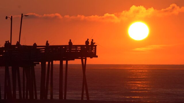 The view of sunrise near Virginia Beach Fishing Pier, U.S.A
