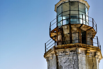 abandoned lighthouse with clear deterioration over time