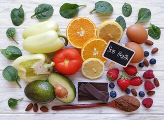 Foods for healthy glowing skin. Assortment of various natural food products high in vitamins and minerals for skin health. Nutrition for beautiful supple skin. Beauty foods healthy eating concept.