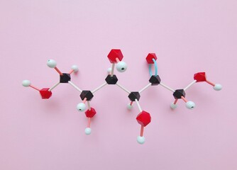 Molecular structure model of fructose molecule. Fructose, or fruit sugar, is a simple ketonic...