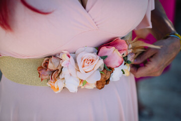 Midsection Of Woman Wearing Flower On Dress